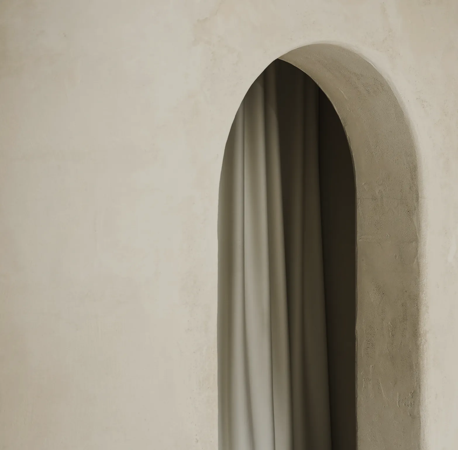 A plaster archway hung with a linen curtain